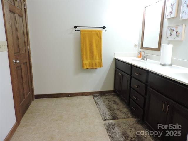 235 Red Oak Ln, Burnsville, NC 28714 - bathroom featuring double vanity and baseboards