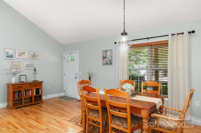 20 Grove Garden Ave, Candler, NC 28715 - dining room featuring light wood-type flooring, baseboards, and vaulted ceiling