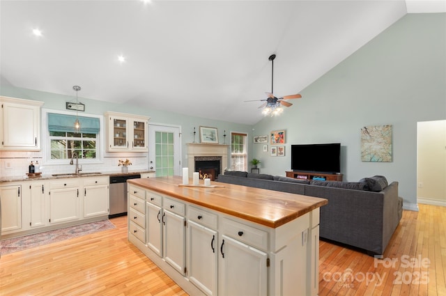 20 Grove Garden Ave, Candler, NC 28715 - kitchen featuring dishwasher, wood counters, a sink, a fireplace, and ceiling fan