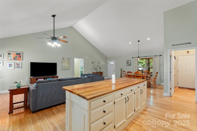 20 Grove Garden Ave, Candler, NC 28715 - kitchen featuring high vaulted ceiling, light wood finished floors, ceiling fan, wooden counters, and open floor plan
