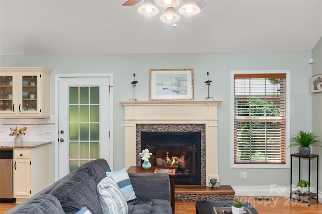 20 Grove Garden Ave, Candler, NC 28715 - living area featuring a high end fireplace, a ceiling fan, and light wood finished floors
