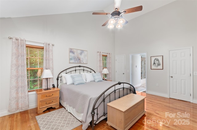 20 Grove Garden Ave, Candler, NC 28715 - bedroom with high vaulted ceiling, light wood finished floors, baseboards, ceiling fan, and ensuite bath