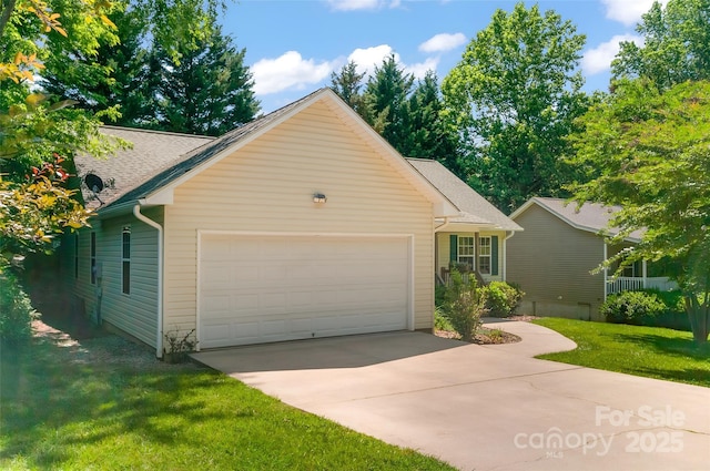 20 Grove Garden Ave, Candler, NC 28715 - view of front of property featuring an attached garage, concrete driveway, a front lawn, and a shingled roof