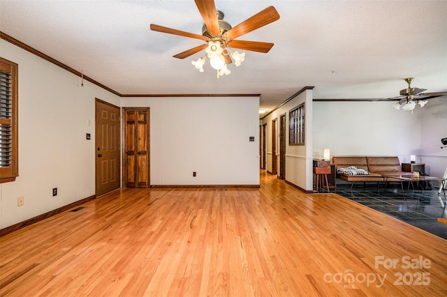 1142 Foxberry Rd, Lincolnton, NC 28092 - unfurnished living room with a ceiling fan, crown molding, wood finished floors, and baseboards