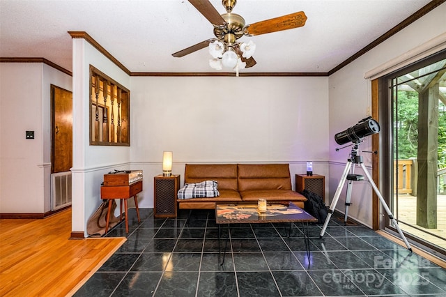 1142 Foxberry Rd, Lincolnton, NC 28092 - living area with crown molding, a ceiling fan, baseboards, and tile patterned flooring