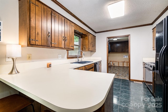 1142 Foxberry Rd, Lincolnton, NC 28092 - kitchen featuring a sink, electric stove, light countertops, a textured ceiling, and a peninsula