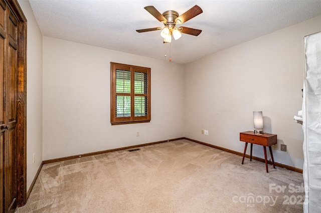 1142 Foxberry Rd, Lincolnton, NC 28092 - empty room with light colored carpet, a ceiling fan, and baseboards