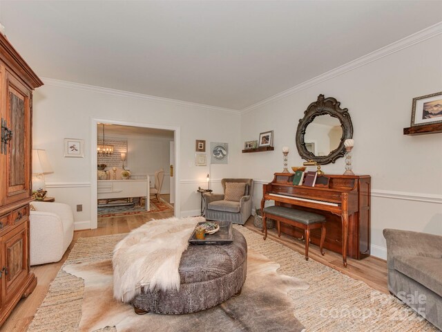 4201 Quail Hunt Ln, Charlotte, NC 28226 - sitting room with ornamental molding, light wood finished floors, a chandelier, and baseboards