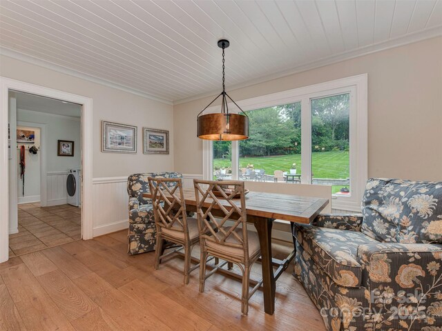 4201 Quail Hunt Ln, Charlotte, NC 28226 - dining space featuring crown molding, light wood-style flooring, wainscoting, and wooden ceiling