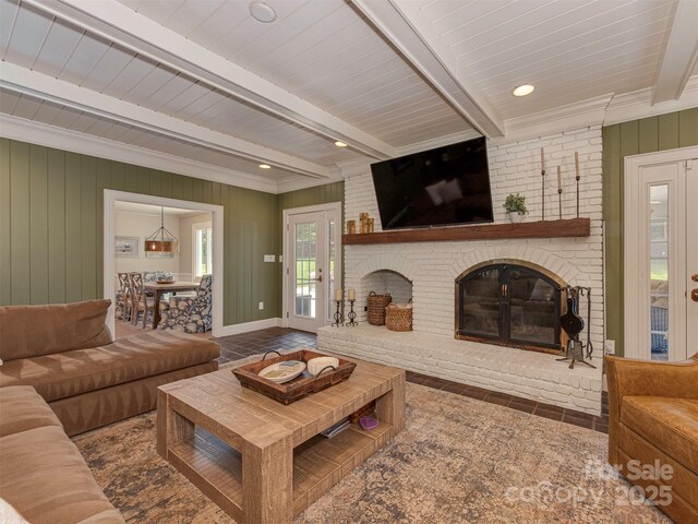 4201 Quail Hunt Ln, Charlotte, NC 28226 - living area featuring beamed ceiling, a brick fireplace, and wooden walls