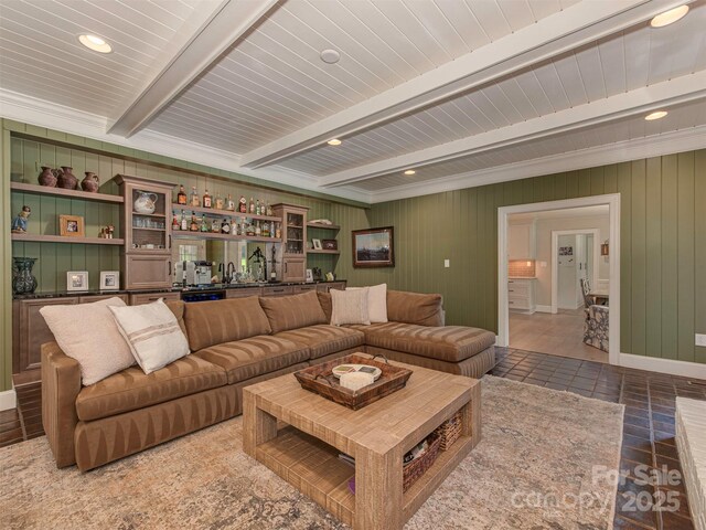 4201 Quail Hunt Ln, Charlotte, NC 28226 - living room with bar with sink, beamed ceiling, recessed lighting, and wood walls
