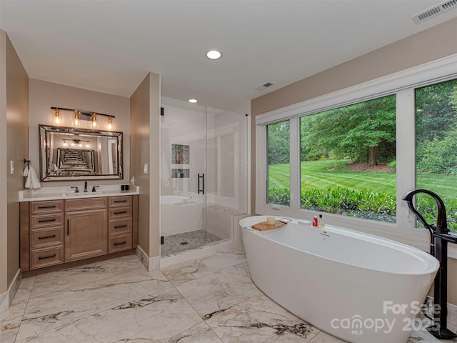 4201 Quail Hunt Ln, Charlotte, NC 28226 - full bathroom featuring vanity, a shower stall, a soaking tub, baseboards, and recessed lighting