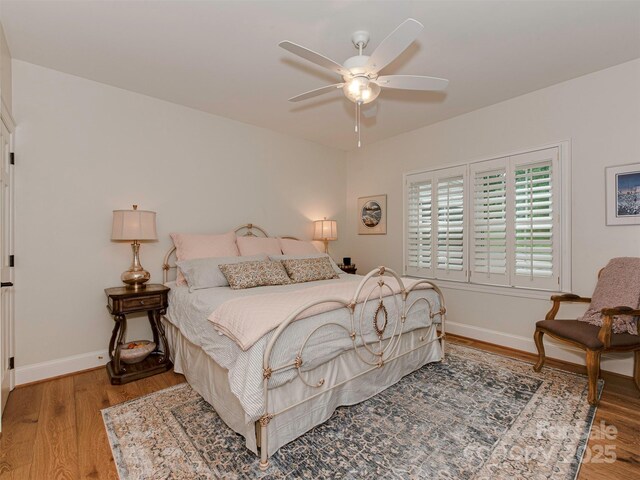 4201 Quail Hunt Ln, Charlotte, NC 28226 - bedroom featuring wood finished floors, baseboards, and ceiling fan