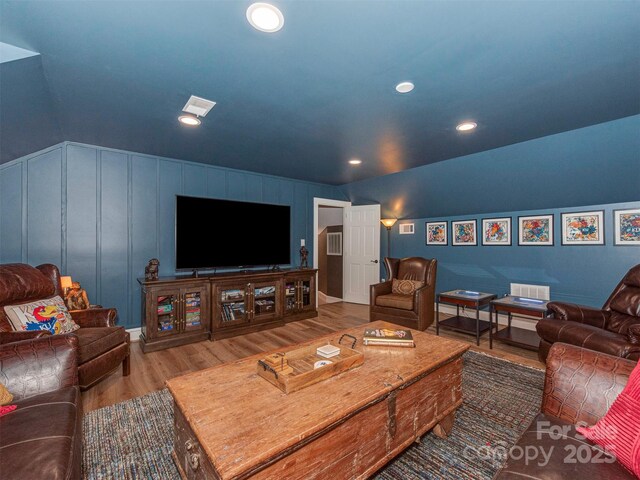 4201 Quail Hunt Ln, Charlotte, NC 28226 - living area featuring a decorative wall, wood finished floors, and recessed lighting