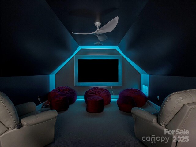 4201 Quail Hunt Ln, Charlotte, NC 28226 - carpeted home theater room with a ceiling fan and vaulted ceiling