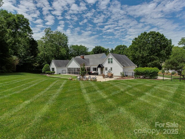 4201 Quail Hunt Ln, Charlotte, NC 28226 - rear view of house with a patio area and a chimney