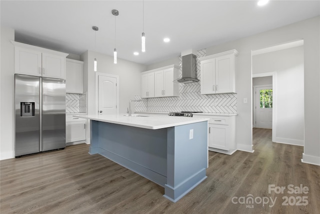 1016 Confederate Ave S, Rock Hill, SC 29732 - kitchen with stainless steel refrigerator with ice dispenser, wall chimney range hood, backsplash, a sink, and white cabinets