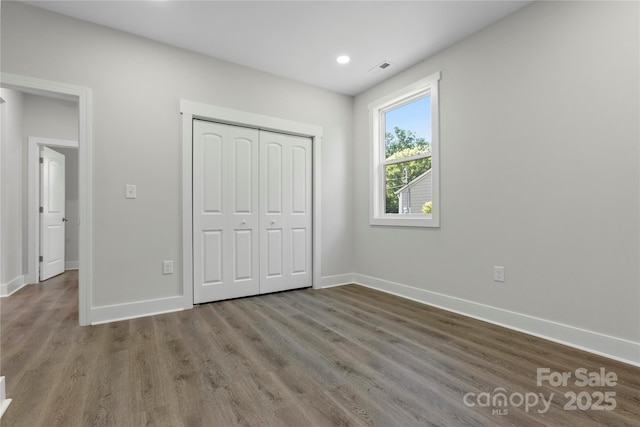 1016 Confederate Ave S, Rock Hill, SC 29732 - unfurnished bedroom featuring baseboards, wood finished floors, a closet, and recessed lighting