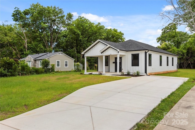 1016 Confederate Ave S, Rock Hill, SC 29732 - modern farmhouse style home with board and batten siding, a porch, driveway, a front yard, and roof with shingles