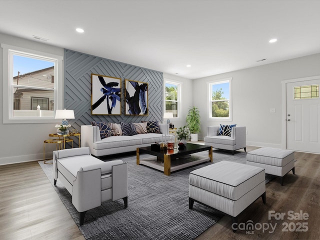 1016 Confederate Ave S, Rock Hill, SC 29732 - living room featuring baseboards, wood finished floors, recessed lighting, and an accent wall