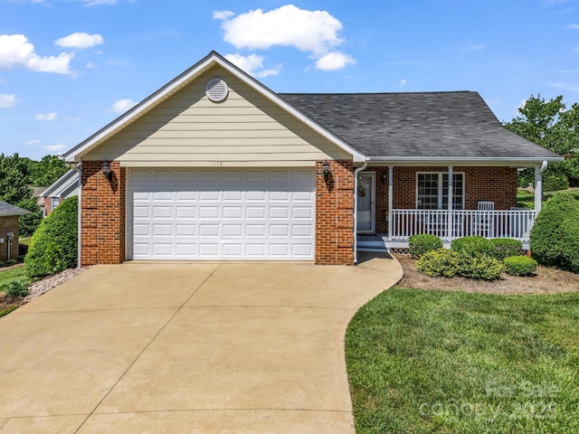 116 Memphis Way, Spindale, NC 28160 - view of front of home with brick siding, covered porch, concrete driveway, an attached garage, and roof with shingles