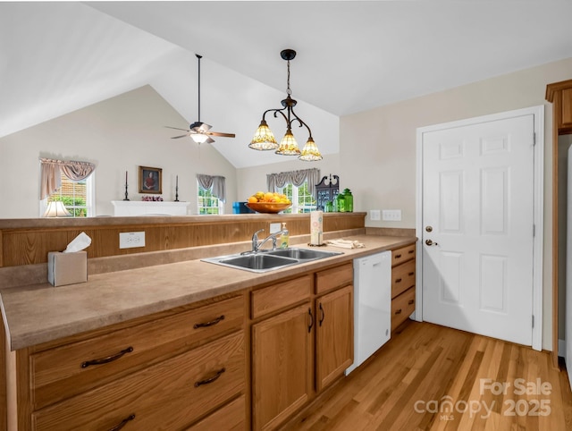 116 Memphis Way, Spindale, NC 28160 - kitchen featuring dishwasher, light wood-type flooring, light countertops, decorative light fixtures, and a sink