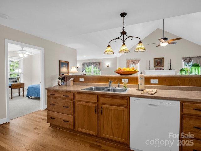 116 Memphis Way, Spindale, NC 28160 - kitchen with white dishwasher, a sink, a ceiling fan, light wood finished floors, and hanging light fixtures