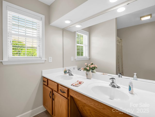 116 Memphis Way, Spindale, NC 28160 - bathroom featuring double vanity, baseboards, and recessed lighting