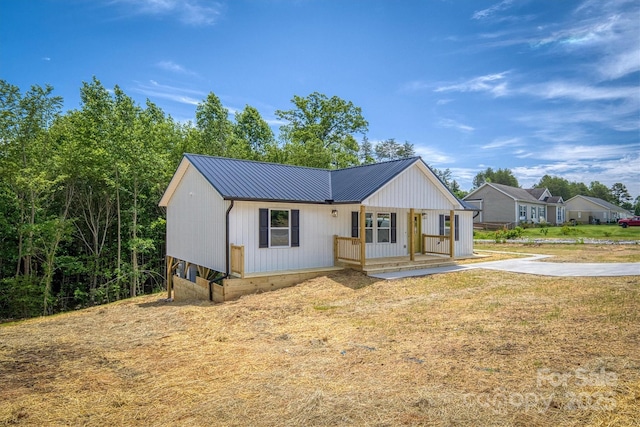 2934 Drummond St, Connelly Springs, NC 28612 - modern farmhouse style home with covered porch and metal roof