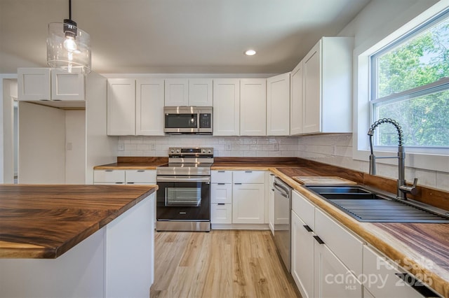 2934 Drummond St, Connelly Springs, NC 28612 - kitchen featuring wooden counters, appliances with stainless steel finishes, a sink, white cabinets, and recessed lighting