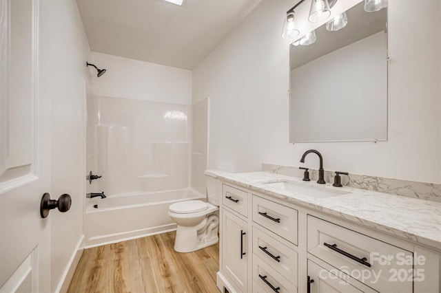 2934 Drummond St, Connelly Springs, NC 28612 - full bath featuring wood finished floors, vanity, toilet, and shower / bath combination