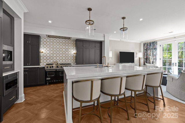 1625 Bibury Ln, Charlotte, NC 28211 - kitchen featuring a sink, open floor plan, double oven range, light stone countertops, and ornamental molding
