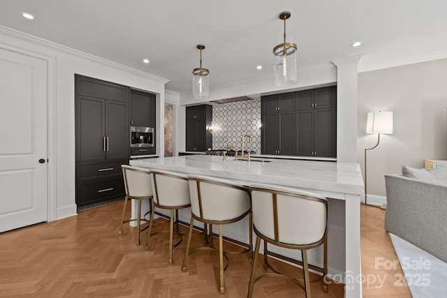 1625 Bibury Ln, Charlotte, NC 28211 - kitchen with ornamental molding, a sink, a kitchen breakfast bar, recessed lighting, and a large island