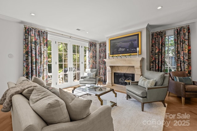 1625 Bibury Ln, Charlotte, NC 28211 - living room featuring crown molding, french doors, plenty of natural light, a high end fireplace, and recessed lighting