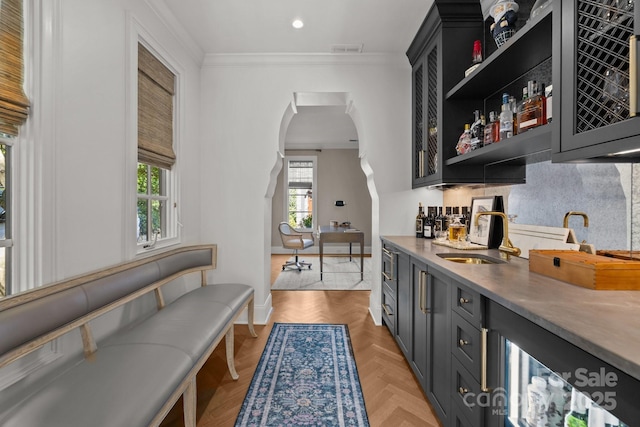 1625 Bibury Ln, Charlotte, NC 28211 - indoor wet bar with ornamental molding, arched walkways, baseboards, and recessed lighting