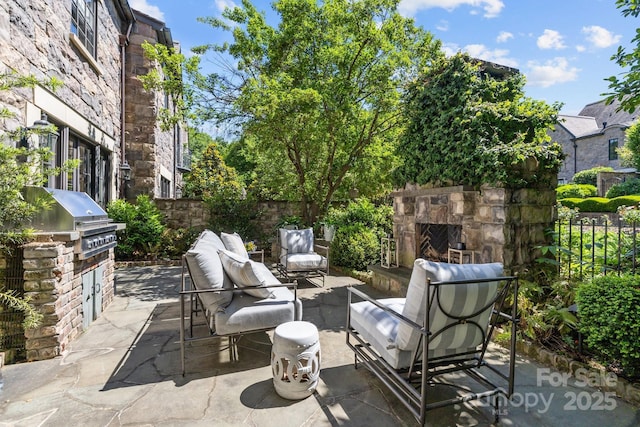 1625 Bibury Ln, Charlotte, NC 28211 - view of patio with an outdoor living space with a fireplace