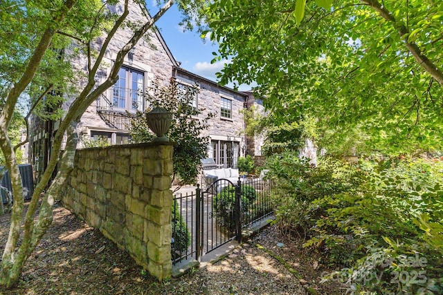 1625 Bibury Ln, Charlotte, NC 28211 - view of home's exterior featuring a gate and stone siding