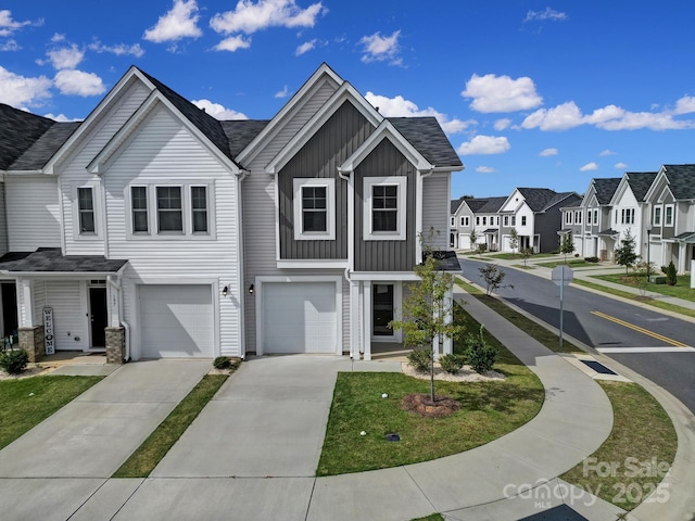 149 Briana Marie Way, Indian Trail, NC 28079 - view of property with board and batten siding, a residential view, driveway, and an attached garage