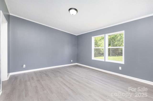 4750 Enochville Rd, Kannapolis, NC 28081 - empty room with crown molding, baseboards, wood finished floors, and vaulted ceiling