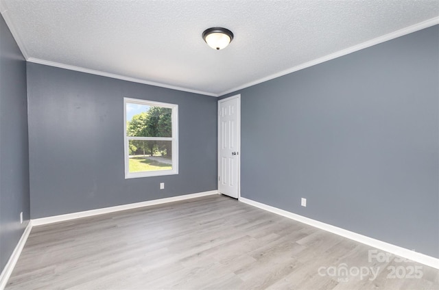4750 Enochville Rd, Kannapolis, NC 28081 - spare room with wood finished floors, a textured ceiling, crown molding, and baseboards