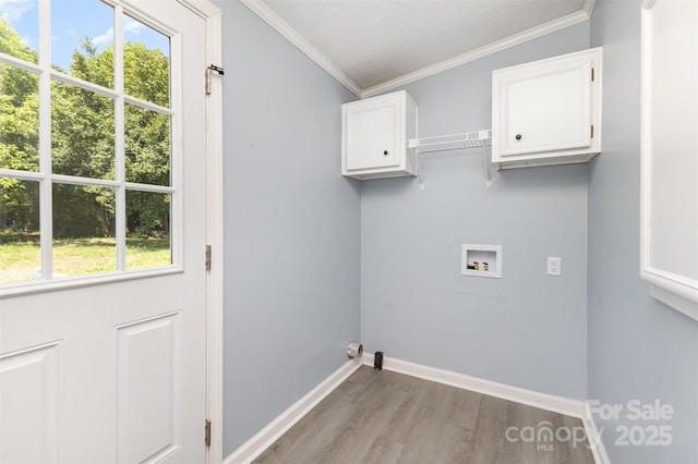 4750 Enochville Rd, Kannapolis, NC 28081 - laundry area featuring cabinet space, washer hookup, wood finished floors, baseboards, and ornamental molding