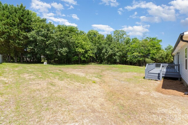 4750 Enochville Rd, Kannapolis, NC 28081 - view of grassy yard with a deck