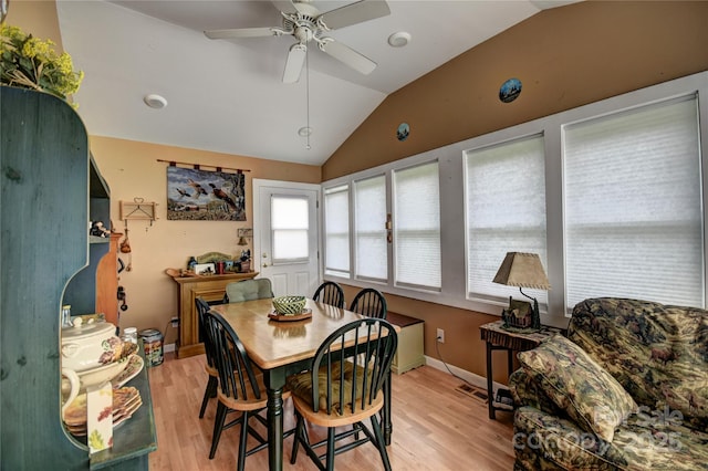74 Sunflower Ln, Waynesville, NC 28785 - dining room featuring lofted ceiling, light wood-style floors, a ceiling fan, and baseboards