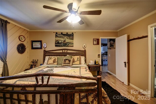 74 Sunflower Ln, Waynesville, NC 28785 - bedroom featuring light wood-style floors, crown molding, ceiling fan, and baseboards