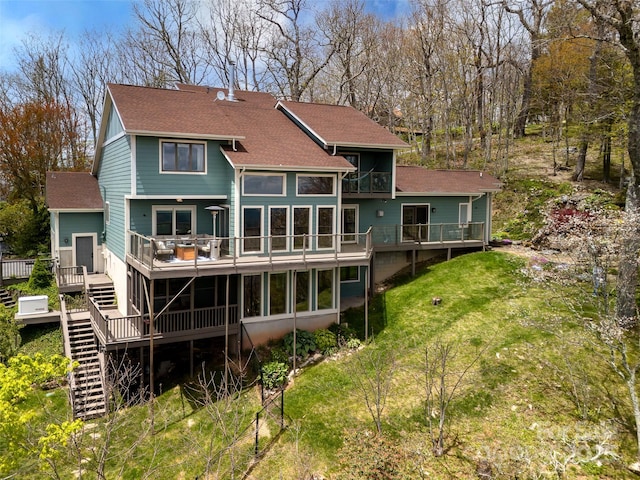 4344 Eagles Nest Rd, Waynesville, NC 28786 - rear view of house featuring roof with shingles, a wooden deck, stairs, a sunroom, and a lawn