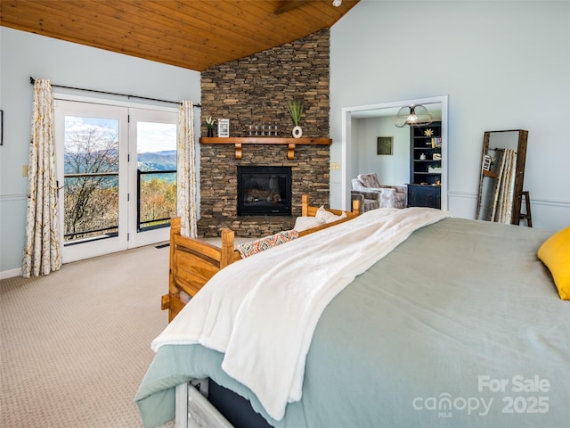4344 Eagles Nest Rd, Waynesville, NC 28786 - bedroom with wood ceiling, access to outside, carpet floors, a stone fireplace, and high vaulted ceiling