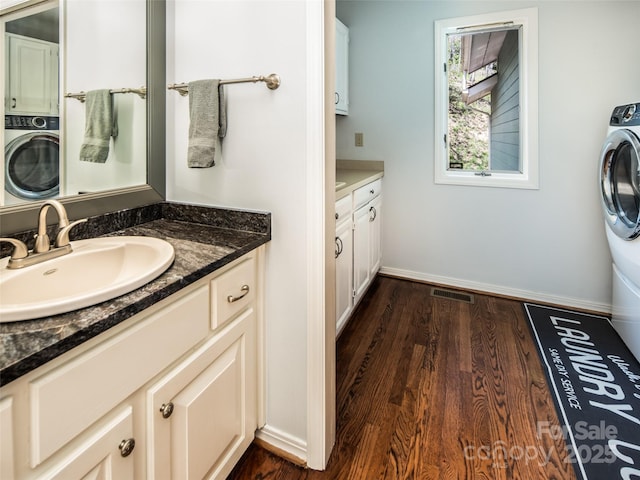 4344 Eagles Nest Rd, Waynesville, NC 28786 - washroom featuring cabinet space, dark wood finished floors, and baseboards