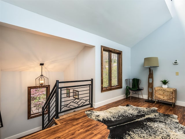 4344 Eagles Nest Rd, Waynesville, NC 28786 - living room with vaulted ceiling, dark wood-style flooring, baseboards, and a chandelier
