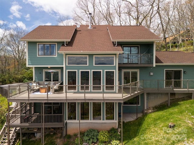 4344 Eagles Nest Rd, Waynesville, NC 28786 - rear view of house featuring a balcony, roof with shingles, a lawn, and a sunroom