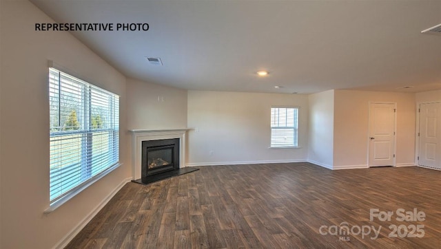 921 Two Brothers Ln, York, SC 29745 - unfurnished living room with dark wood-style floors and a glass covered fireplace